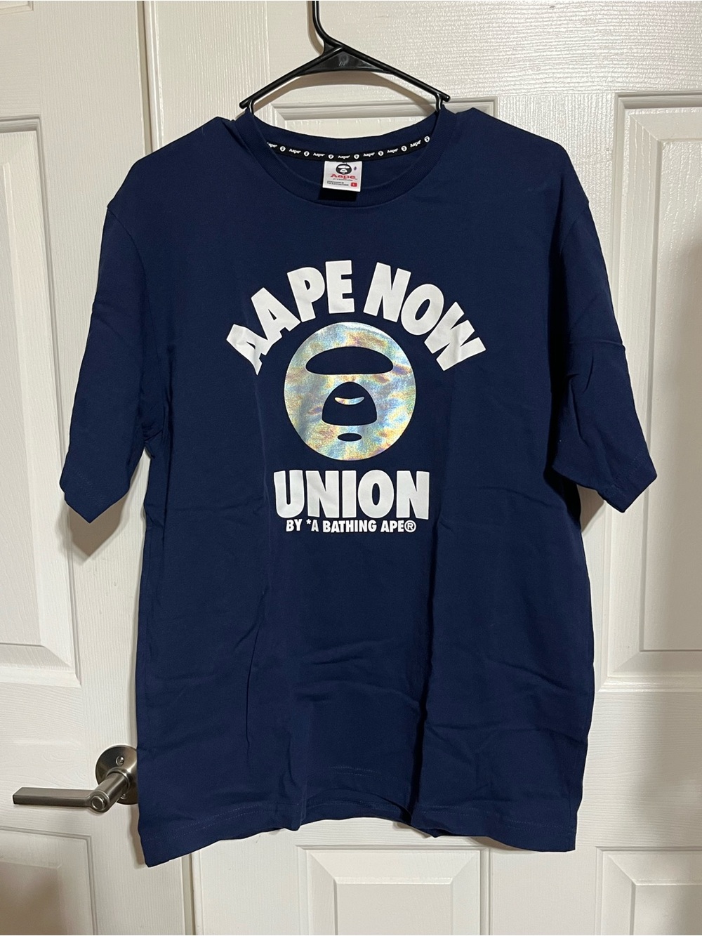 Bape Navy NOW Union Logo Tee with Iridescent Ape Head
17-07